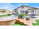 A backyard paradise with a custom pool, spa, and elegant patio furniture, perfect for relaxation and entertaining at 6392 Ebony Legends Ave, Las Vegas, NV 89131