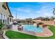 Aerial view of the backyard featuring a sparkling pool and comfortable outdoor seating at 6392 Ebony Legends Ave, Las Vegas, NV 89131