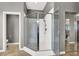 Modern shower with glass enclosure, a built-in bench, and a sleek showerhead at 6392 Ebony Legends Ave, Las Vegas, NV 89131