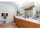 Bathroom featuring dual sinks, tile floors, and vanity at 6578 Chimes Tower Ave, Las Vegas, NV 89139