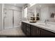 Modern bathroom with dual sinks, a spacious walk-in shower with glass enclosure, and stylish finishes for a spa-like experience at 6818 Sweet Bay St # Lot 11, Las Vegas, NV 89166