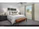 Serene main bedroom with wood accent wall, plush bedding, and ample natural light creating a peaceful retreat at 6818 Sweet Bay St # Lot 11, Las Vegas, NV 89166