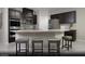 Modern kitchen with granite countertops, stainless steel appliances, and stylish dark cabinetry at 6826 Sweet Bay St # Lot 10, Las Vegas, NV 89166