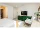 Bright bedroom features a green dresser, a white rocking chair, and an open walk-in closet at 683 Quasi St, Henderson, NV 89011