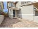 Inviting front entrance with a decorative wreath and brick paved driveway at 683 Quasi St, Henderson, NV 89011