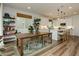 Open-concept kitchen with a spacious island and barstool seating connected to the dining area at 683 Quasi St, Henderson, NV 89011