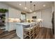 Modern kitchen with a large island and breakfast bar and stainless steel appliances at 683 Quasi St, Henderson, NV 89011