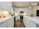 Modern kitchen featuring white cabinetry, stainless steel appliances, and elegant countertops at 683 Quasi St, Henderson, NV 89011