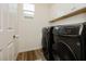 Laundry room featuring a modern, dark-colored washer and dryer set at 683 Quasi St, Henderson, NV 89011