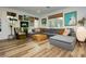 Spacious living room featuring sleek floors, a comfortable sofa, and trendy decor at 683 Quasi St, Henderson, NV 89011