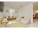 Bright living room with a comfortable couch, bean bag chairs, and an adjacent bedroom at 683 Quasi St, Henderson, NV 89011