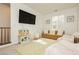 Living room featuring a TV, couch, bean bag chairs, and a play kitchen at 683 Quasi St, Henderson, NV 89011