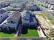 Aerial view of homes with modern design, solar panels, and well-manicured lawns at 7082 Sayonara Vista St, North Las Vegas, NV 89084