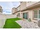 The property features a fenced backyard with artificial grass and patio at 7232 N Decatur Blvd # 4, Las Vegas, NV 89131