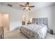 Spacious bedroom featuring a queen-sized bed, soft carpeting, a ceiling fan and natural light at 7232 N Decatur Blvd # 4, Las Vegas, NV 89131