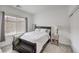 Cozy bedroom with natural light, a dark bed frame, and a sliding door closet at 7232 N Decatur Blvd # 4, Las Vegas, NV 89131