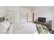 Well-lit bedroom with a bed, dresser, and sliding closet doors at 7232 N Decatur Blvd # 4, Las Vegas, NV 89131