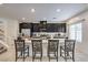 Open kitchen featuring dark cabinets, quartz countertops and stainless appliances at 7232 N Decatur Blvd # 4, Las Vegas, NV 89131