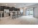 Kitchen with dark cabinets, stainless steel appliances, and a slider to the backyard at 7232 N Decatur Blvd # 4, Las Vegas, NV 89131