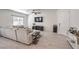 Living room featuring a neutral-colored sectional and wood-look tile flooring at 7232 N Decatur Blvd # 4, Las Vegas, NV 89131