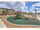 Neighborhood playground featuring a slide, climbing structure, and safe rubber surface at 7232 N Decatur Blvd # 4, Las Vegas, NV 89131