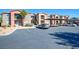 Exterior view of a multi-Gathering apartment complex with carports and ample parking space at 8000 W Badura Ave # 1130, Las Vegas, NV 89113