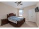 A cozy bedroom with a ceiling fan, a window, and a closet at 8000 W Badura Ave # 1130, Las Vegas, NV 89113