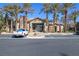 Community clubhouse with parking lot, mature trees, and desert landscaping at 8000 W Badura Ave # 1130, Las Vegas, NV 89113