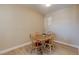 Cozy dining area with a round wooden table, four chairs, and modern flooring at 8000 W Badura Ave # 1130, Las Vegas, NV 89113
