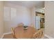 Charming dining area adjacent to the kitchen with a wooden table and four chairs at 8000 W Badura Ave # 1130, Las Vegas, NV 89113