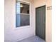 Exterior front entry door with window and unit number at 8000 W Badura Ave # 1130, Las Vegas, NV 89113