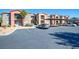 Apartment building featuring covered parking, desert landscaping and balconies at 8000 W Badura Ave # 1130, Las Vegas, NV 89113