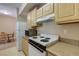 Kitchen area with modern appliances and light wood cabinetry at 8000 W Badura Ave # 1130, Las Vegas, NV 89113