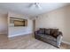 Open-concept living room with hardwood floors, neutral paint, and view to the kitchen at 8000 W Badura Ave # 1130, Las Vegas, NV 89113