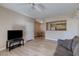 Open living area featuring hardwood floors, access to dining area and natural light at 8000 W Badura Ave # 1130, Las Vegas, NV 89113