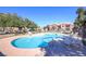 Community pool with lounge chairs, providing a refreshing oasis for relaxation and recreation at 8000 W Badura Ave # 1130, Las Vegas, NV 89113