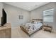 Spare bedroom provides ample space for relaxing and watching TV in a warm and inviting space at 8525 Stokestone St, Las Vegas, NV 89166