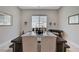 Dining area featuring modern decor, a stylish table, and ample natural light, perfect for gatherings at 8525 Stokestone St, Las Vegas, NV 89166