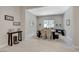 Dining area featuring modern decor, a stylish table, and ample natural light, perfect for gatherings at 8525 Stokestone St, Las Vegas, NV 89166
