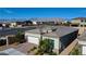 Street view of a house in a suburban neighborhood, well-kept lawns and mountain views in the distance at 8525 Stokestone St, Las Vegas, NV 89166