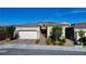 Beautiful single-Gathering home with a 2-car garage, desert landscaping and paved driveway at 8525 Stokestone St, Las Vegas, NV 89166