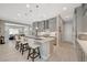 Bright modern kitchen featuring stainless steel appliances, quartz countertops, and a large island with seating at 8525 Stokestone St, Las Vegas, NV 89166
