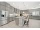 Open Kitchen featuring stainless steel appliances, quartz countertops and a large island with seating at 8525 Stokestone St, Las Vegas, NV 89166