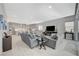 Bright open floorplan including Gathering room and kitchen with modern tile flooring throughout at 8525 Stokestone St, Las Vegas, NV 89166