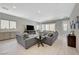 Bright, open-concept living room featuring recessed lighting and modern tile flooring throughout at 8525 Stokestone St, Las Vegas, NV 89166