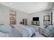 This main bedroom features recessed lighting, nice furniture, and an adjoining bathroom at 8525 Stokestone St, Las Vegas, NV 89166