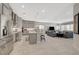 Bright, open-concept living space featuring a modern kitchen and a comfortable seating area, great for entertaining at 8525 Stokestone St, Las Vegas, NV 89166