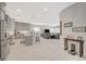 Bright, open-concept living space featuring a modern kitchen and a comfortable seating area, great for entertaining at 8525 Stokestone St, Las Vegas, NV 89166