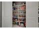 Organized walk-in pantry with shelving stocked with an assortment of food items and beverages at 8525 Stokestone St, Las Vegas, NV 89166