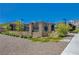 Neighborhood pool area is surrounded by landscaping, rock ground covering, and black wrought iron fencing at 8525 Stokestone St, Las Vegas, NV 89166